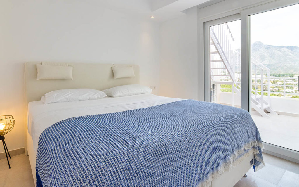 Simple white airy bedroom in Costa del Sol