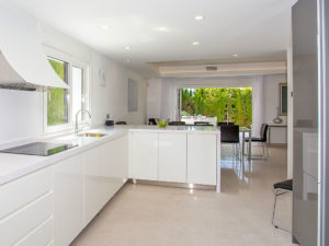 modern white kitchen looking to green terrace in the Costa del Sol