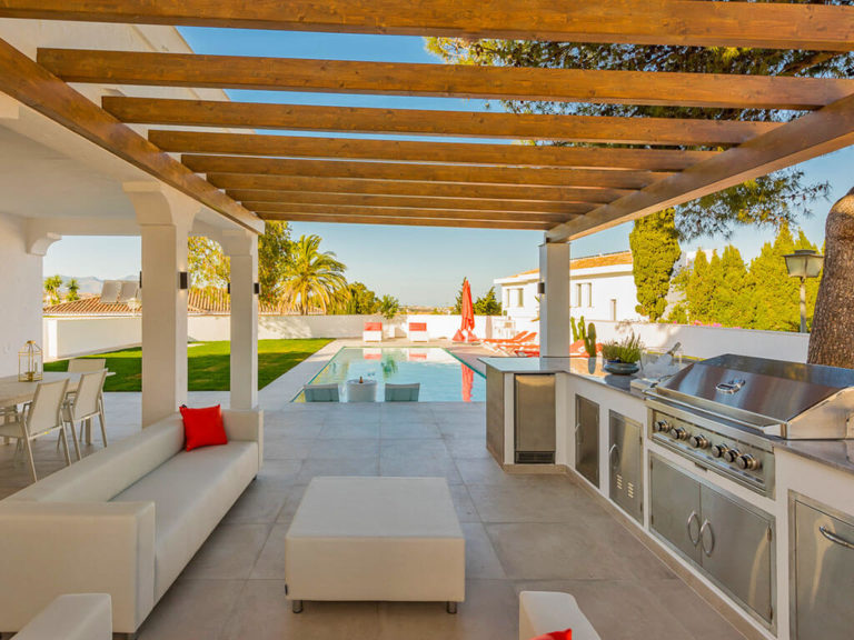 Stylish outdoor kitchen with pool