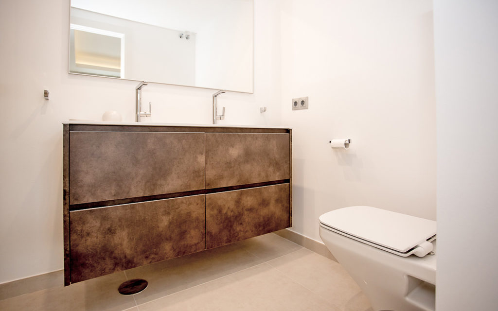 Minimalist brown bathroom with floating vanity with taps in Marbella