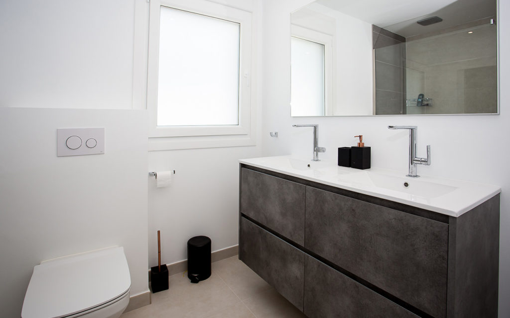 White and dark grey modern bathroom in Marbella
