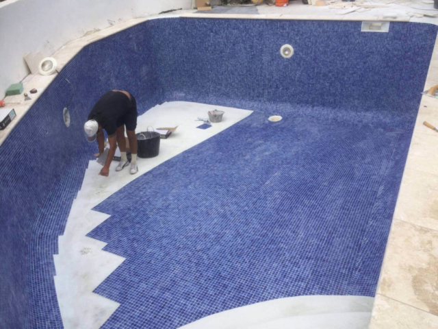 Pool being tiled