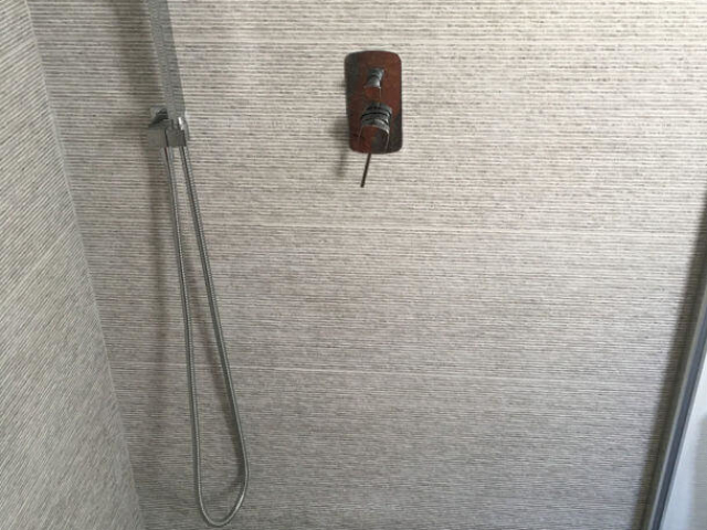 Grey tiled shower room