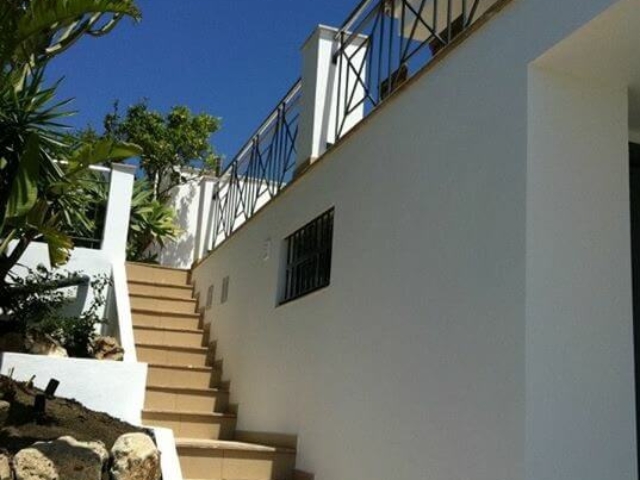 Stairs leading up to the pool