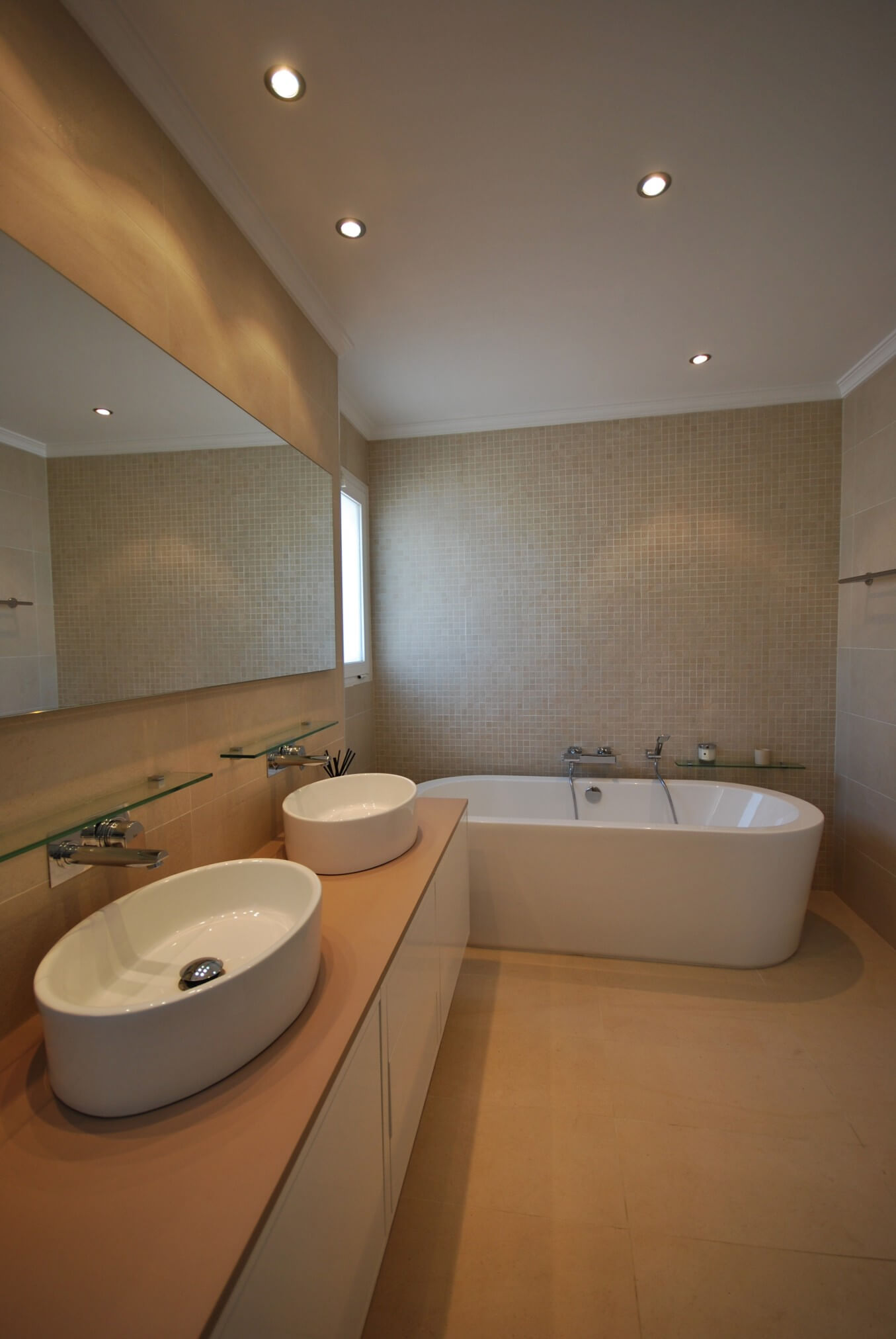 Side view of bathroom and dual-basins