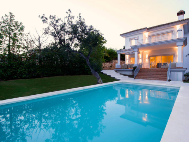 Evening view of a villa by the pool
