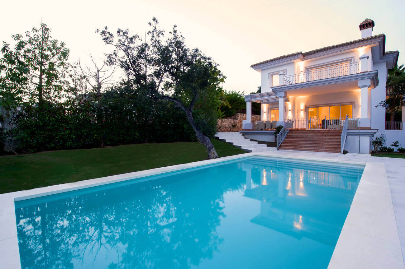 Evening view of a villa by the pool