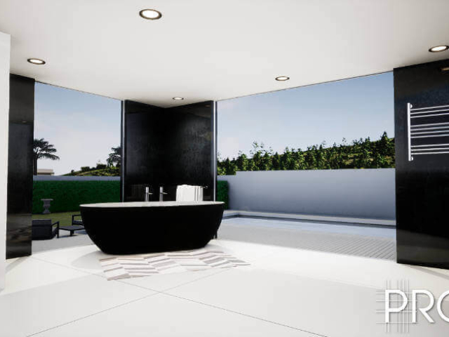 Stylish modern black and white bathroom with black walls and standalone bath and full windows in the Costa del Sol