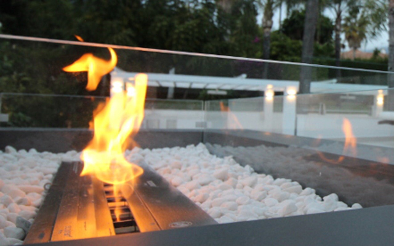 Stunning outdoor ethanal fireplace in chillout area on the Costa del Sol