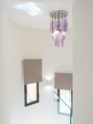 Refurbished stairway with purple contemporary feature light