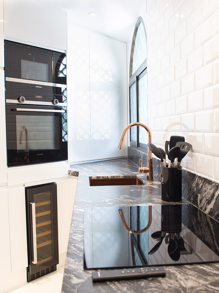 Contemporary corner design kitchen, white and black, granite benchtop