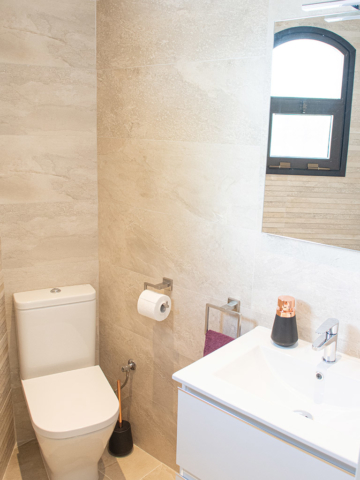 Stylish beige and white powder room or bathroom
