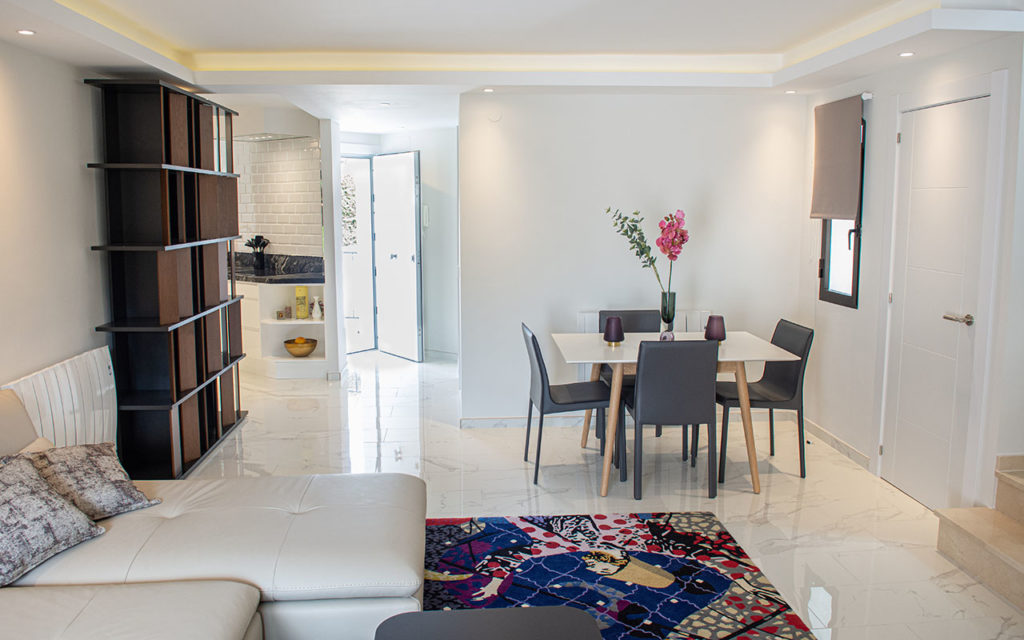 Refurbished living room with open kitchen