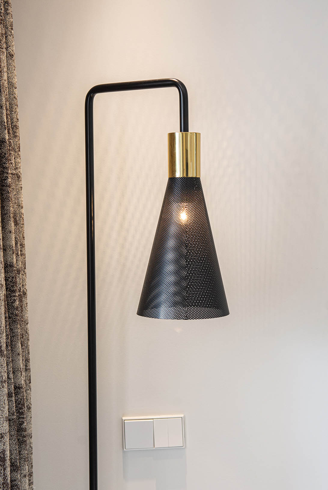 Contemporary black floor lamp and stylish interior design in Marbella