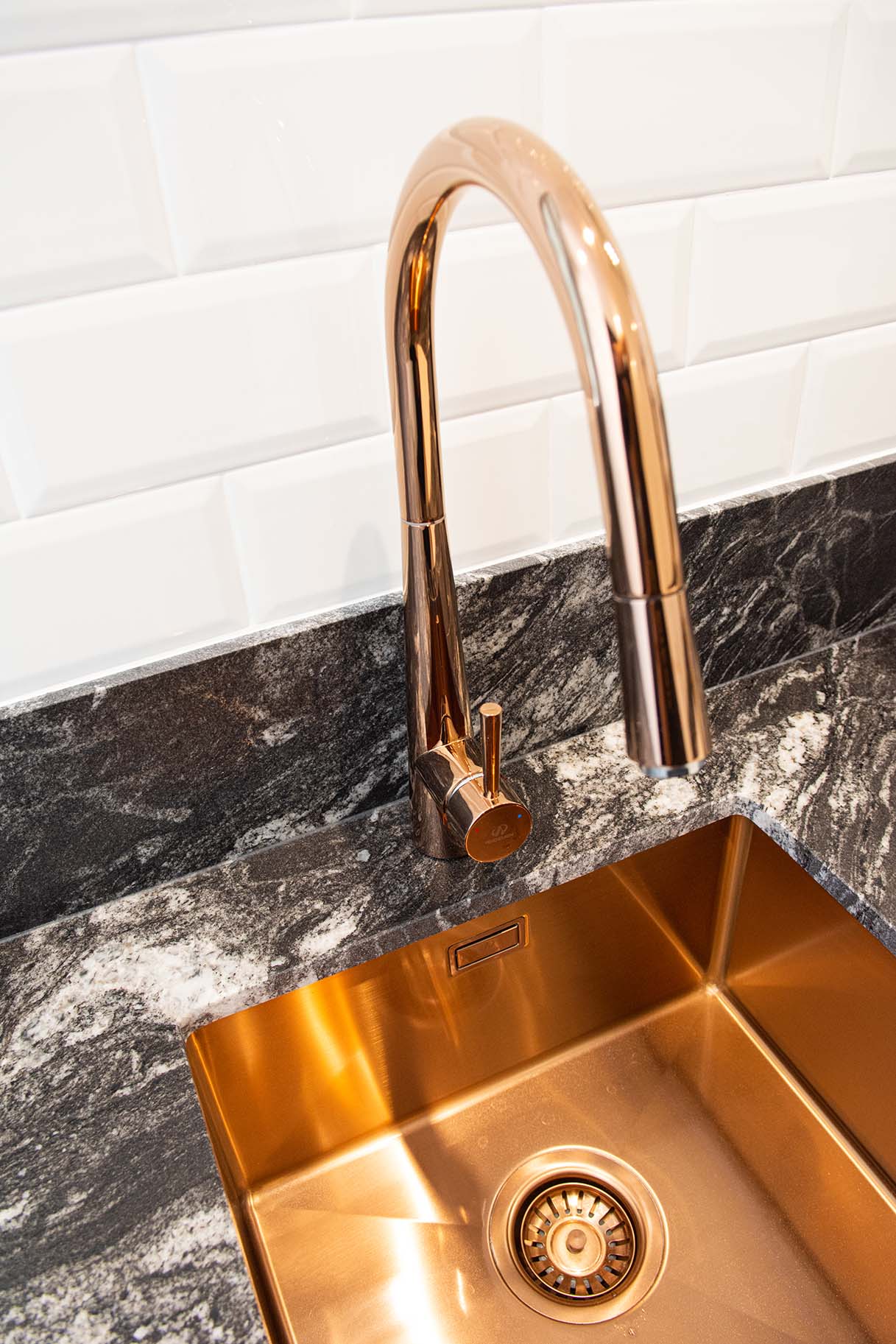 Stylish copper sink and black marble bench in Marbella