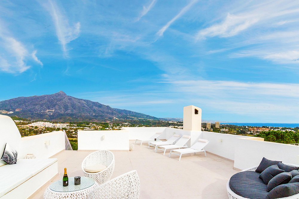 Stylish white rooftop chillout with mountain views in Costa del Sol