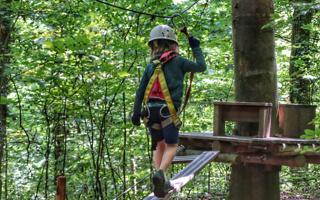 child at zipline park