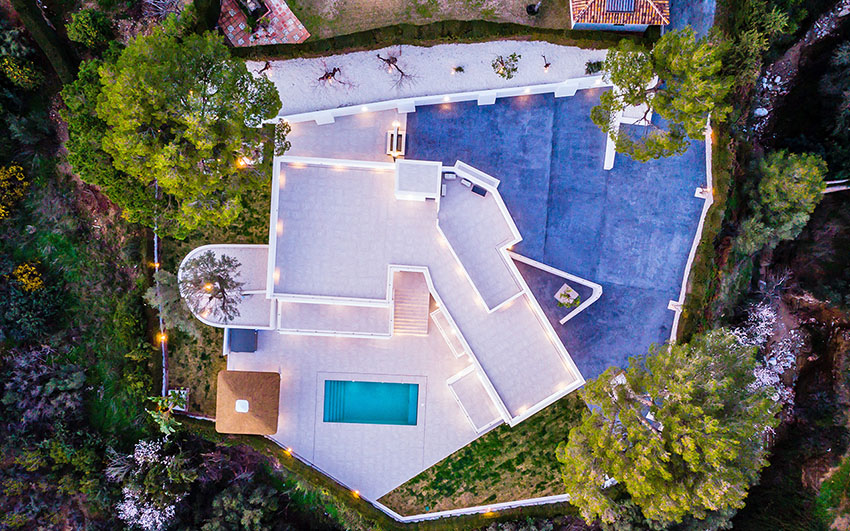 Ariel view of villa with outdoor lighting