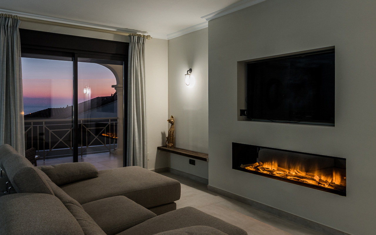 Renovated room with fireplace by ProMas
