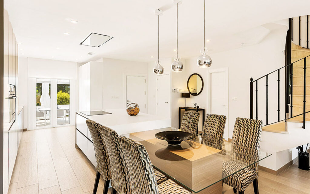 kitchen with island table and pendant lights