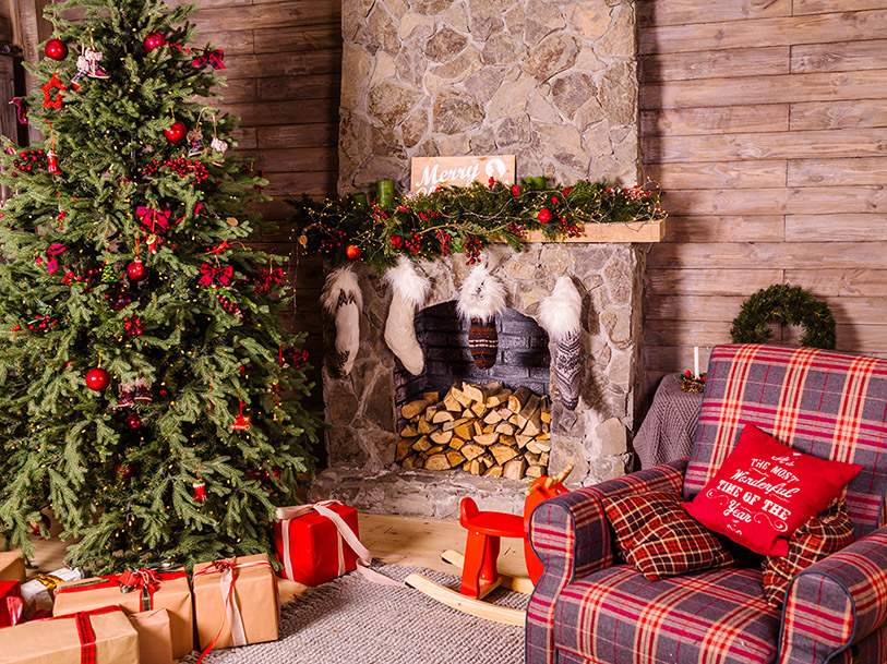 Traditional rustic christmas tree and fireplace