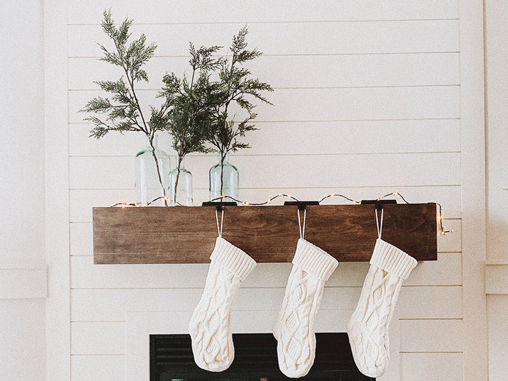 White stockings hanging on fireplace simple Christmas living room