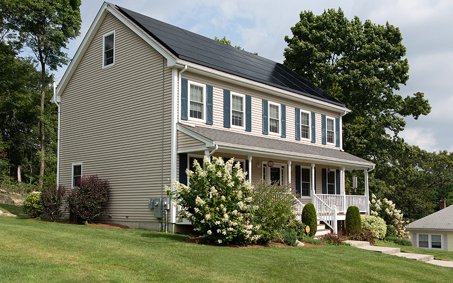 traditional home with solar panels camouflaged