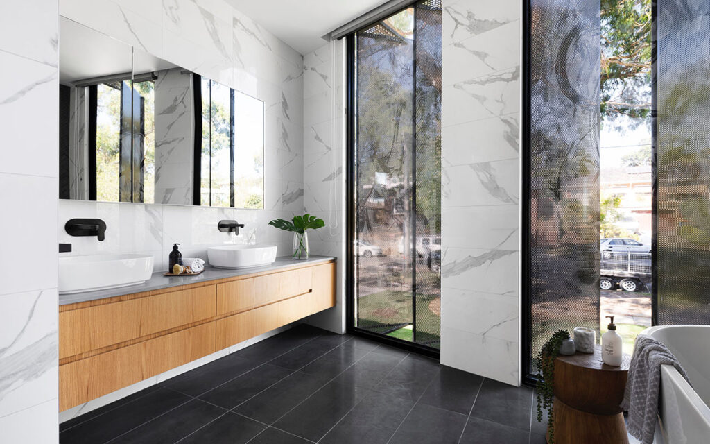 Stylish black marble and timber bathroom
