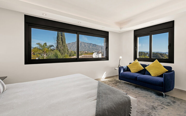 Modern sliding black windows in stylish bedroom