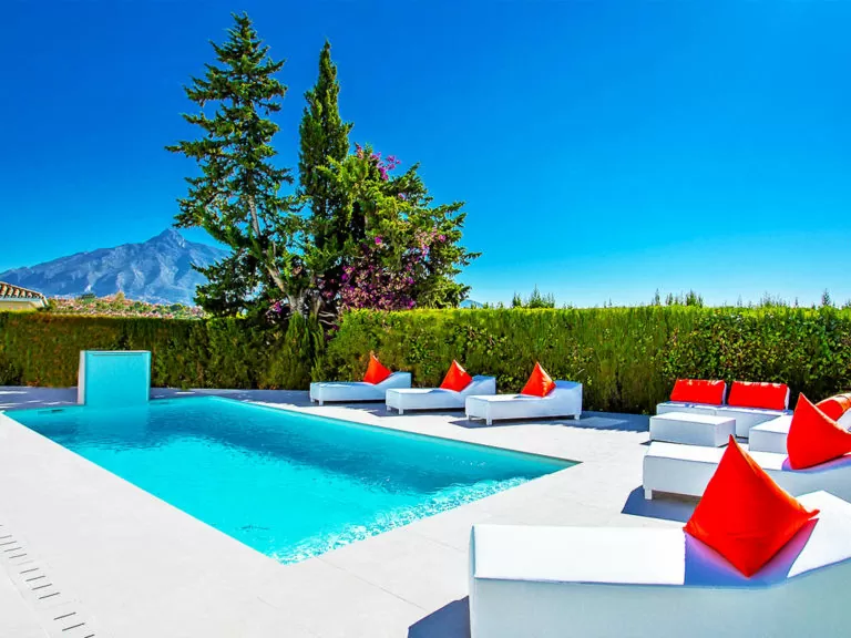 Divine pool next to Marbella mountain with luxury loungers