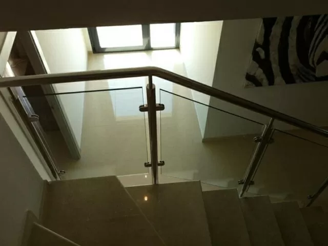 Dark staircase with rails