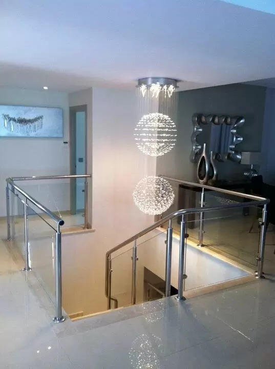 Chandelier over staircase