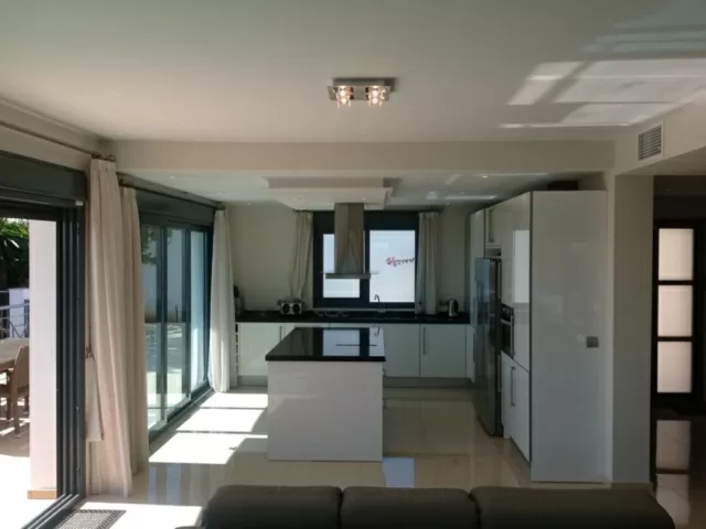 Kitchen island with bi-folding doors