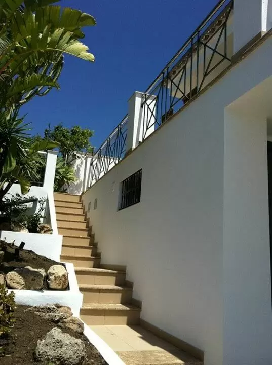 Stairs leading up to the pool