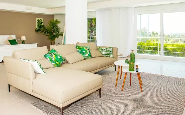 Large white sliding doors leading to terrace from bedroom