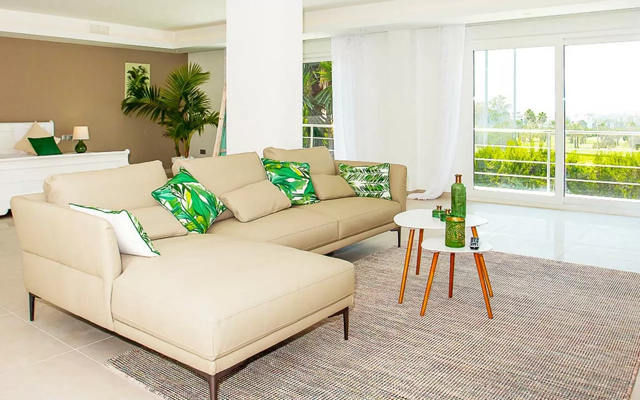 Large white sliding doors leading to terrace from bedroom